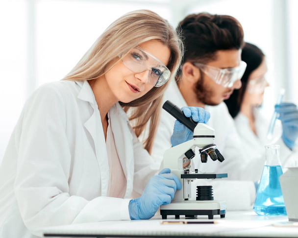 close up.female scientist working in a modern laboratory - 写真・画像