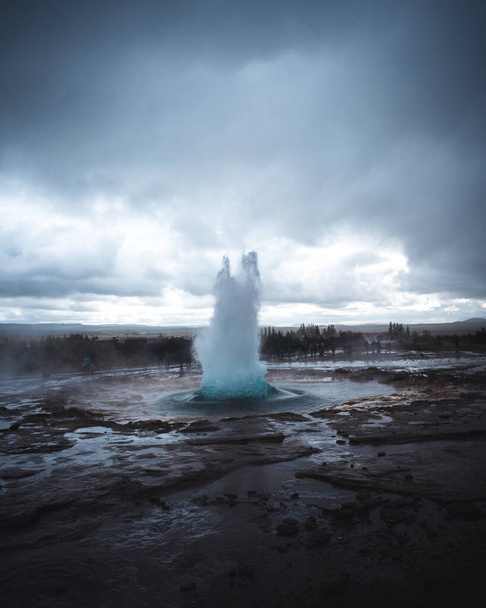 A vertical shot of the Great Geysir exploding in Iceland - Photo, Image