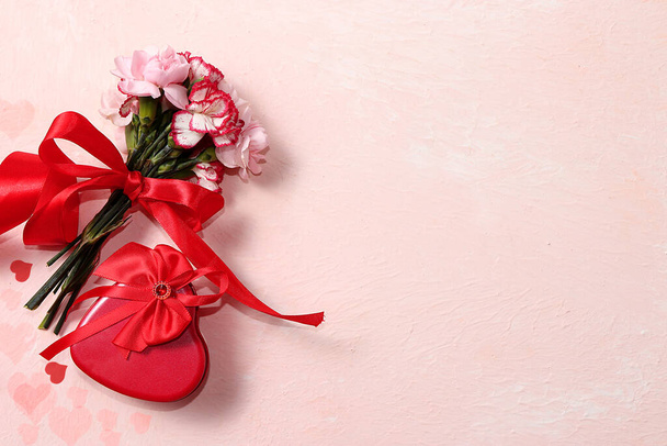 Concept for Valentine's Day or Women's Day. Postcard, hearts, flowers and gift boxes on a pink background, place for text, banner, Happy holidays, congratulations, birthday, wedding, - Foto, afbeelding