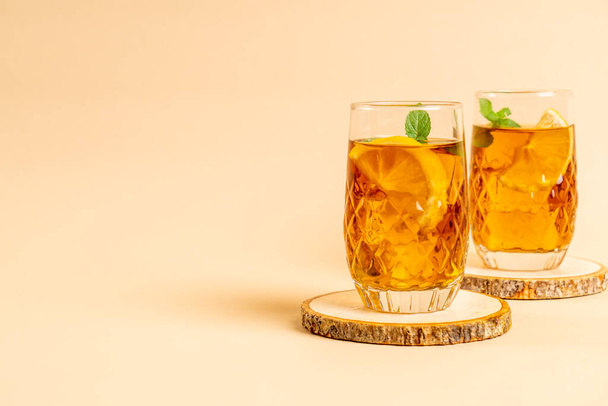 glass of ice lemon tea with mint - Фото, изображение