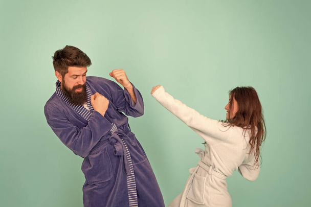 Couple in love bathrobes. Drowsy and weak in morning. Advice relationships surviving quarantine. Morning routine. Couple sleepy faces domestic clothes. All day pajamas. Sleepy people blue background - Фото, изображение