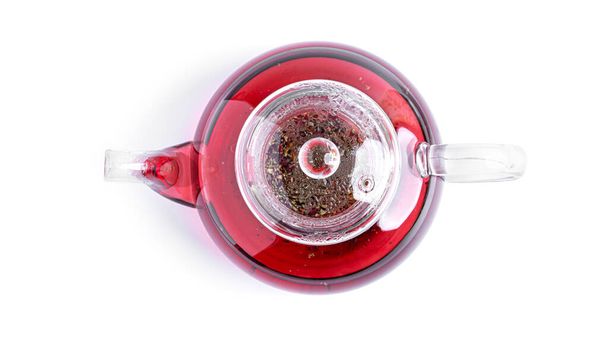 Bule transparente com chá vermelho em um fundo branco. Vista de cima. Foto de alta qualidade - Foto, Imagem