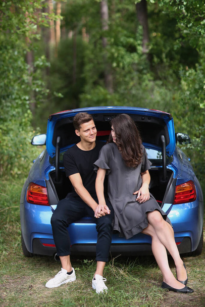 Lovely couple is traveling with a car - Foto, Bild