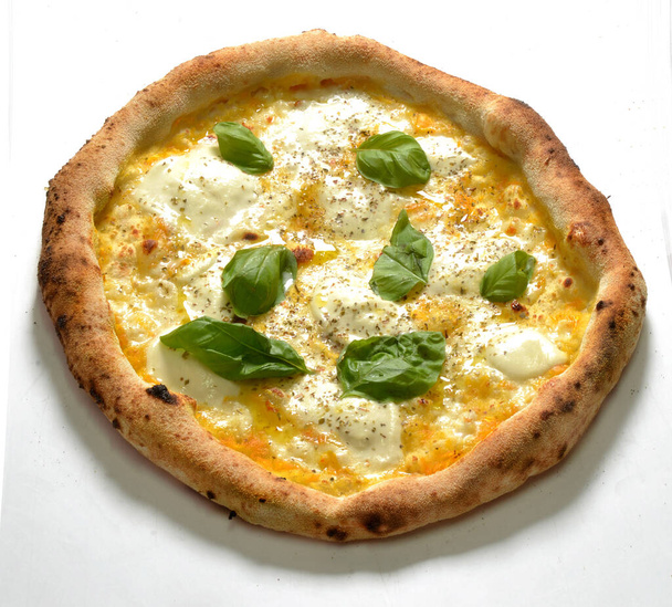 Just baked Mozzarella pizza Napoletan stile with yellow tomato and basil - Foto, Imagen