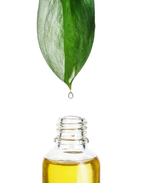 Bottle with essential oil on white background - Photo, Image