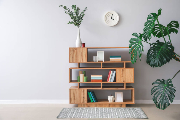 Shelving unit with books and decor in interior of room - Photo, Image