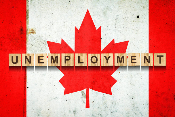 Nezaměstnanost. Nápis na dřevěných blocích na pozadí kanadské vlajky. Růst nezaměstnanosti. Obchod. Job. - Fotografie, Obrázek
