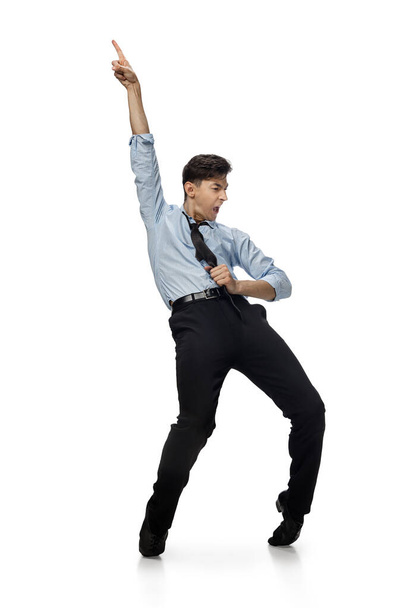 Happy young man dancing in casual clothes or suit, remaking legendary moves of celebrity from culture history - Photo, Image