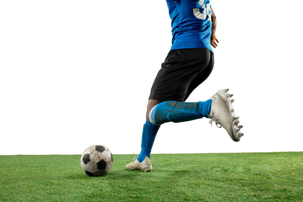 Close up legs of professional soccer, football player fighting for ball on field isolated on white background - 写真・画像