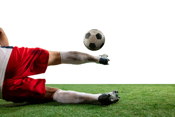 Close up legs of professional soccer, football player fighting for ball on field isolated on white background - Valokuva, kuva