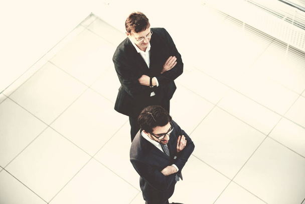 top view. business colleagues standing in the office . - Foto, Bild