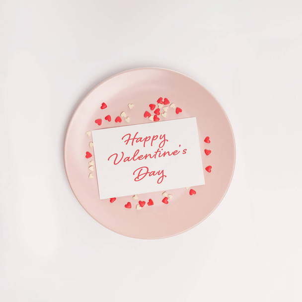 Valentines day greeting card on the plate, top view - Φωτογραφία, εικόνα