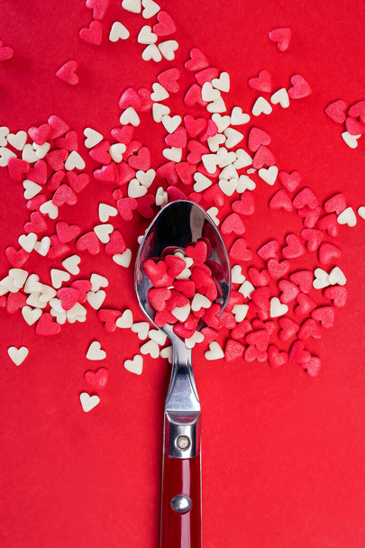 Spoon full of sugar heart shaped sprinkles - Fotografie, Obrázek