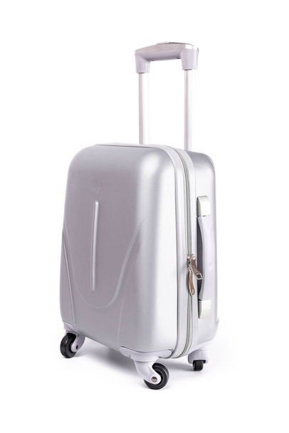 Suitcase white background. Silver plastic luggage or vacation baggage bag isolated. Copy space of summer vacation and business travel concept - Fotó, kép