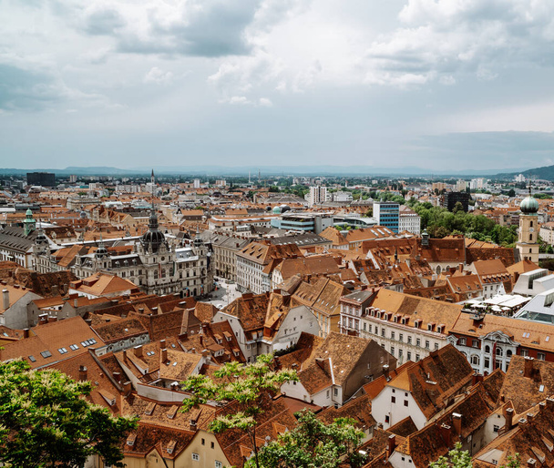 Graz, Austria - June 16, 2020 - aerial view of the old town of Graz Styria from Castle Hill (Schlossberg) with medieval houses, churches and buildings - Zdjęcie, obraz