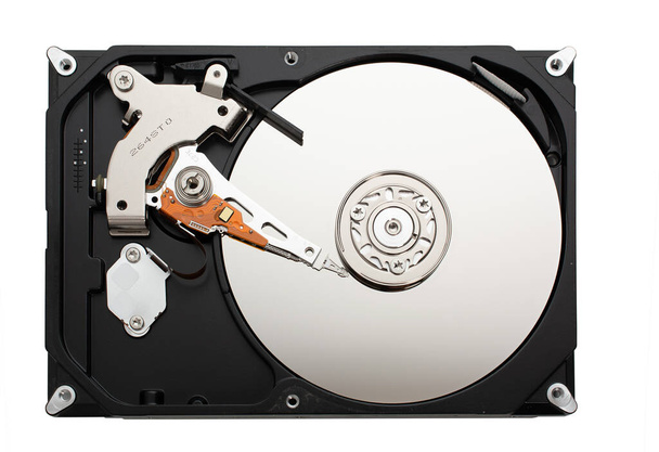 computer hard disk inside view with mirrored blank disks on which data is recorded and a magnetic head. isolated on white. flat lay. copy space. - Photo, Image