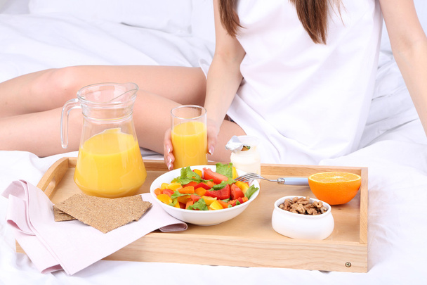 Woman in bed with light breakfast  - Photo, Image