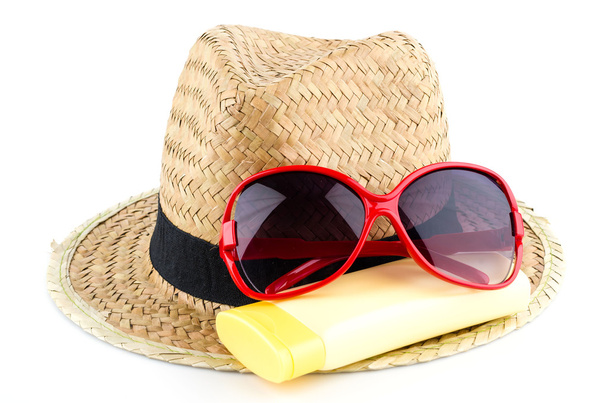 Hat , sunglasses , body lotion isolated on white background - Photo, image