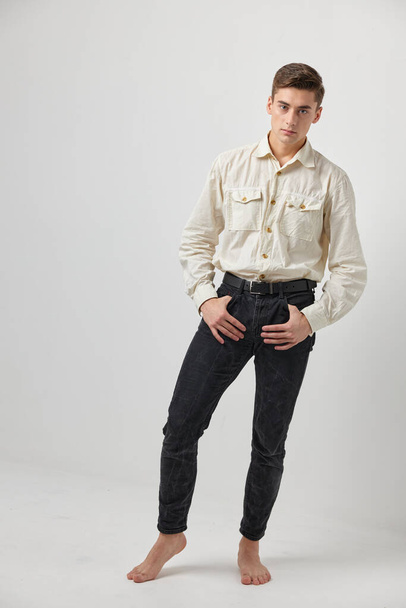 shirt holds hands in pockets posing fashion attractive look - Photo, image