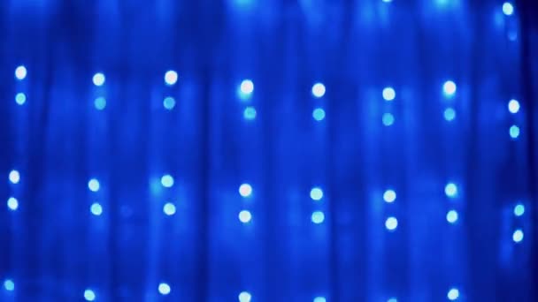 Christmas Garland of Many Blinking, Flickering Blue LED Lights on Curtain. 4K - Footage, Video