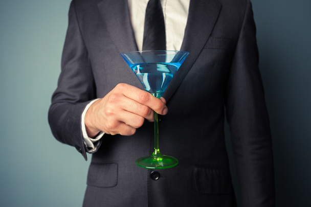 Businessman with cocktail glass - Foto, afbeelding