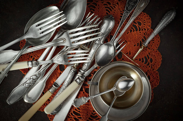 Silver dishes on old background - Фото, зображення