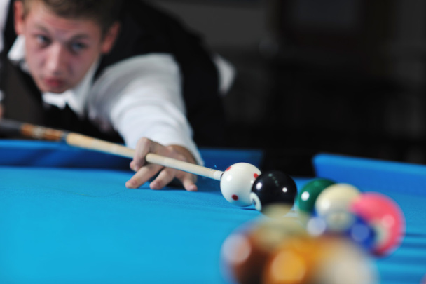 Young man play pro billiard game - Foto, Bild