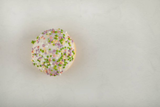 Colorful sweet small doughnut with sprinkles - Photo, image