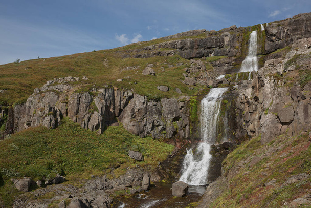 Beautiful cascade waterfall Bleiksarfoss in Eskifjordur, east of Iceland. - Photo, Image
