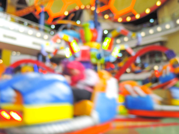 Blur image of indoor theme park with bokeh - Photo, Image