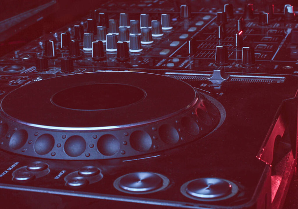 Night club, nightlife concept. Disco. DJ controller. Duotone effect - Photo, Image