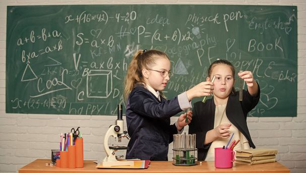 In search of right medical solution. Little scientist work with microscope. Little girls in lab. Chemistry education. science experiments in chemistry laboratory. Chemistry research. Biology lesson - Zdjęcie, obraz