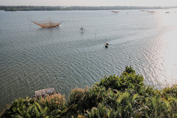 https://cdn.create.vista.com/api/media/small/439195452/stock-photo-aerial-view-stationary-lift-nets-which-traditional-vietnamese-fishing-method