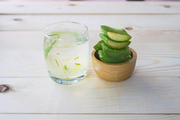 Aloe Vera for drinking on wood table  - Foto, afbeelding