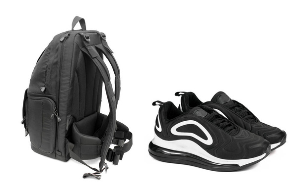 black backpack and black sneakers on a white background - Photo, Image