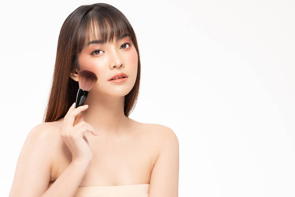 Beauty asian woman hold make up brush  and cheerful with make up brush - 写真・画像