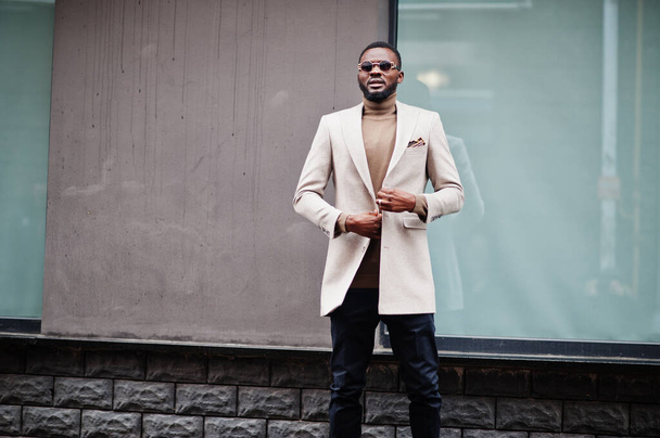 Stylish african american man wear beige jacket with sunglasses. - Photo, Image