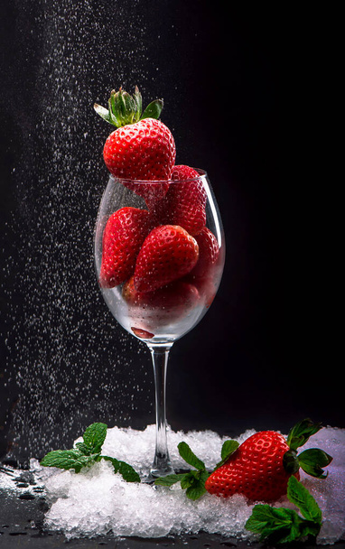 Strawberries in glass on black background - Zdjęcie, obraz