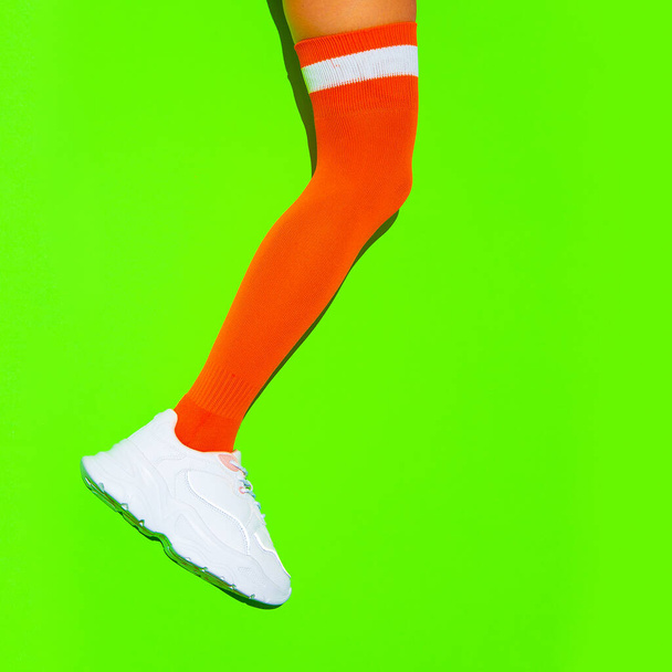 Stylish white Sneakers and vintage sport stockings on fresh green background. Sport fitness summer active vibes - Foto, immagini