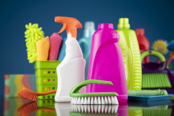 House and office cleaning theme. Colorful cleaning kit on blue background. - Photo, Image