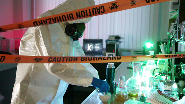 Scientist behind the caution tape laboratory with equipment - Video, Çekim