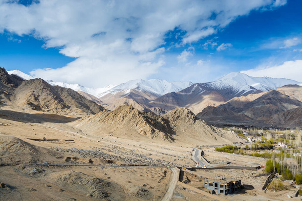 Aerial view  of Leh Ladahk City of Kashmir with background of Himalaya mountain against blue sky, view from the Shanti Stupa - Foto, immagini