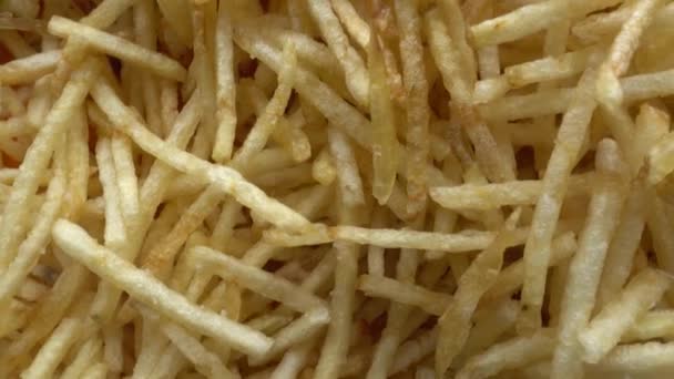Top view of Thin french fries rotating. Fried potato background - Footage, Video