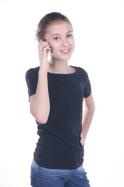 beautiful teenage girl calling by phone isolated on white backgr - Foto, immagini