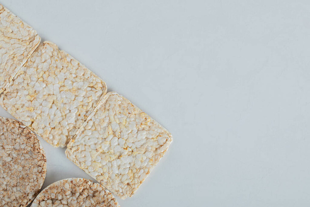 Two types of crispbread on white background - Φωτογραφία, εικόνα