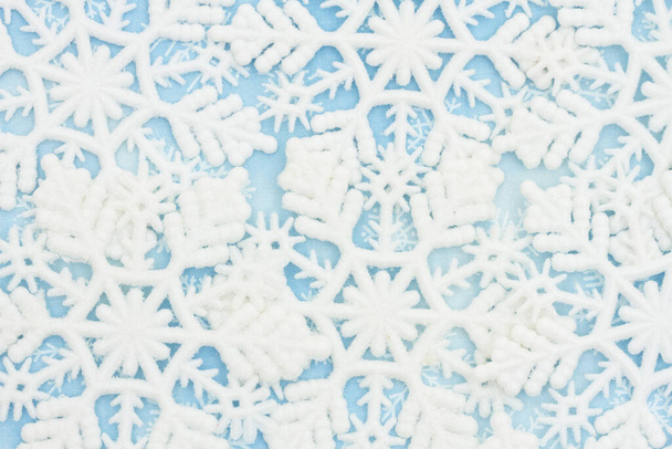 White and blue snowflake background with copy space for winter or holiday backgrounds - Fotografie, Obrázek