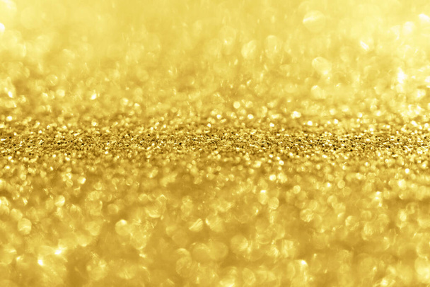 Brillo de brillo de oro abstracto borroso con fondo bokeh - Foto, imagen