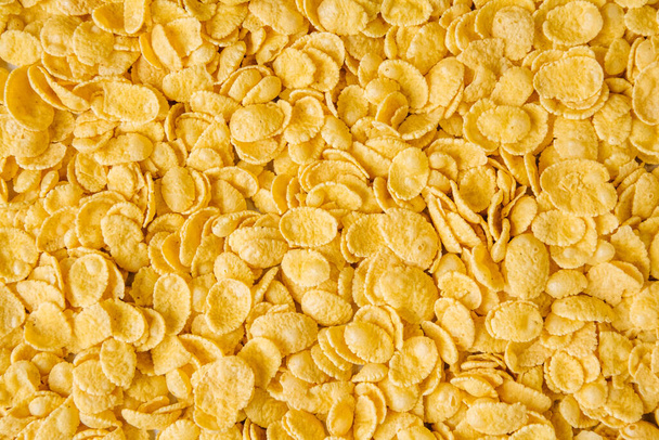 Corn-flakes background and texture. Top view - Φωτογραφία, εικόνα