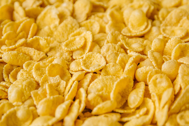 Corn-flakes background and texture. Top view - Foto, afbeelding