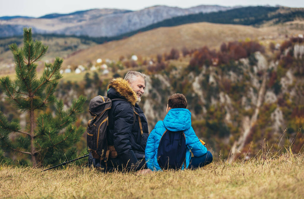 Father with son hiking in nature - Photo, Image